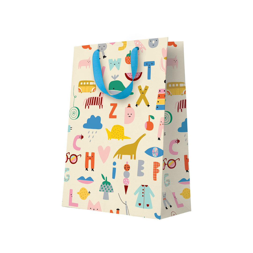 Colourful children's gift bag with alphabet and animal pattern on a white background