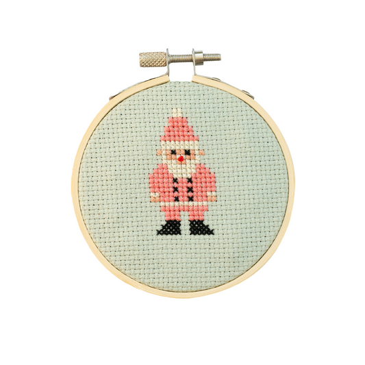 Cross-stitched Santa Claus figure in a wooden hoop