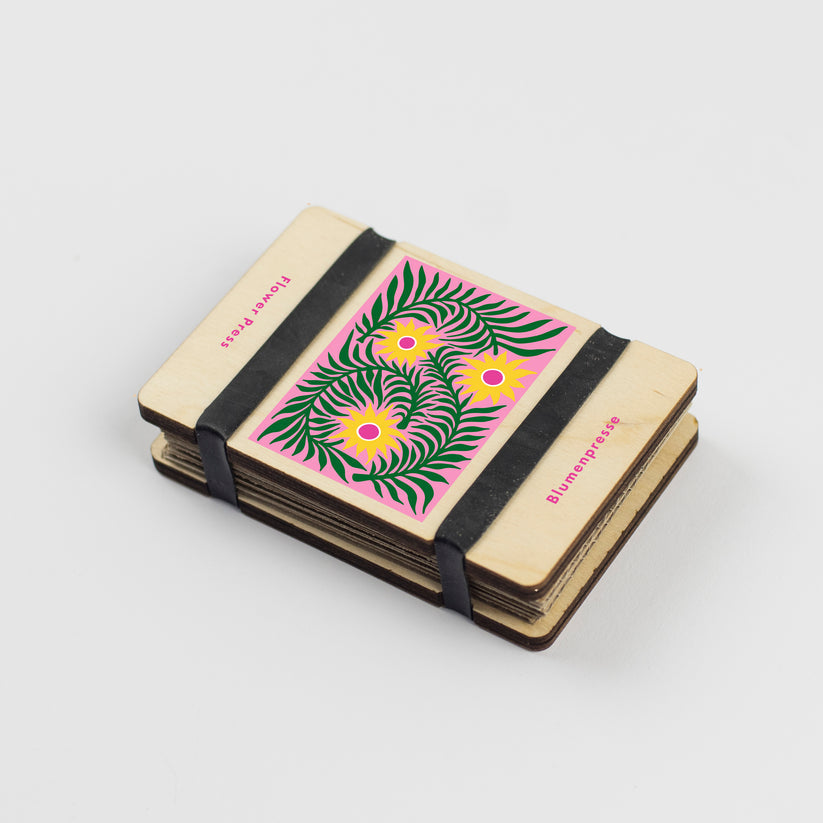 Small rectangle pocket flower press with teasel design and thick elastic to hold together