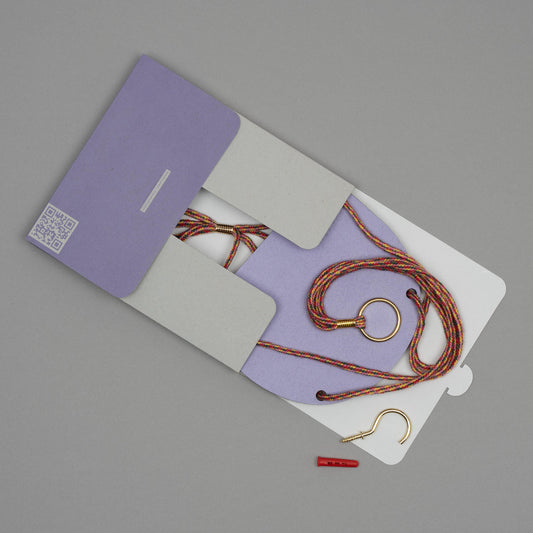 Hanging plant shelf set with purple case on a gray background