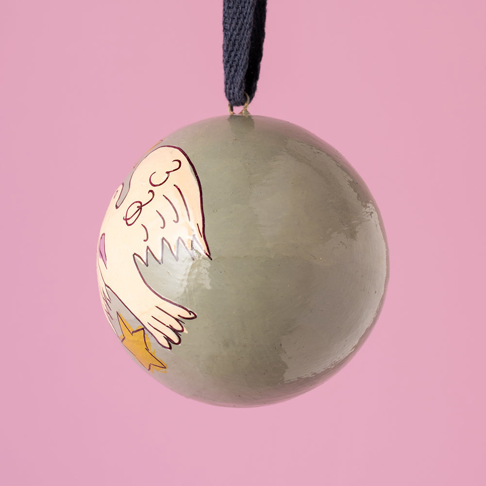Decorative ornament with a cartoon character on a pink background
