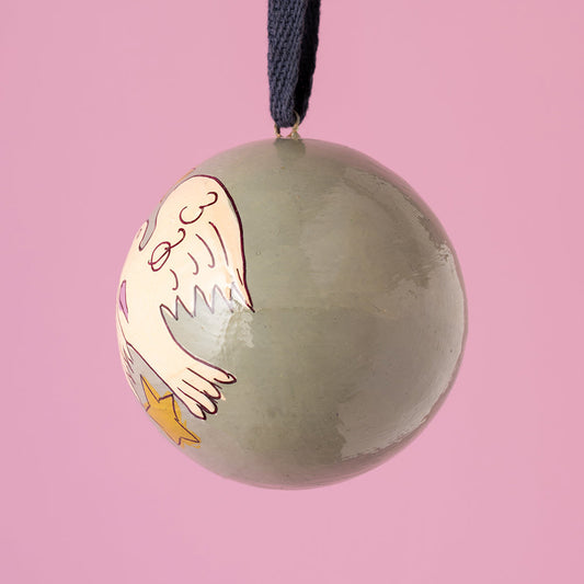 Decorative ornament with a cartoon character on a pink background
