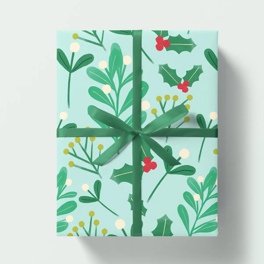 Gift box with festive greenery pattern on a light blue background