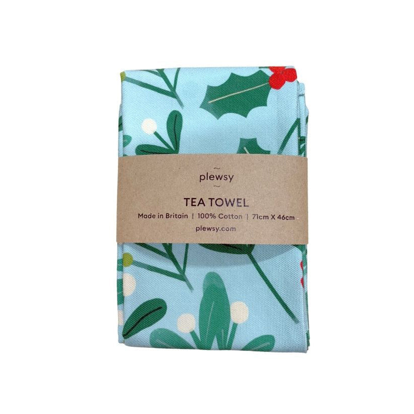 Tea towel with holly leaf design and plewsy branding on a white background