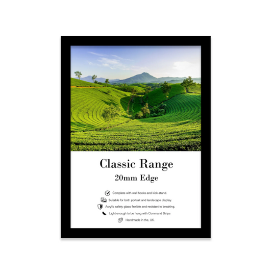 Framed print of a green landscape with mountains, featuring text about the frame's specifications.