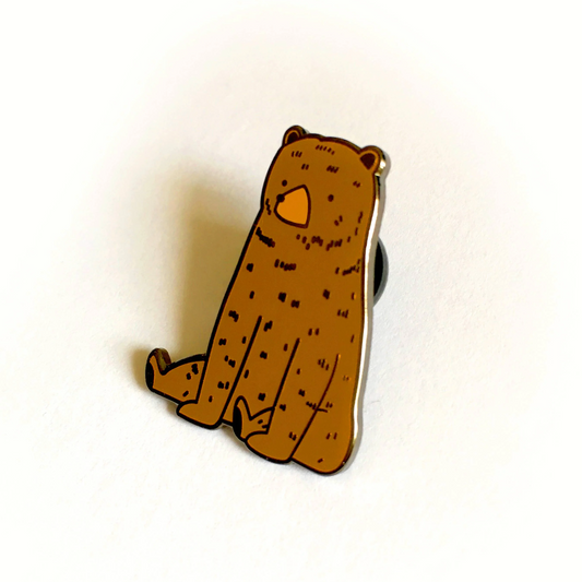 Brown bear-shaped clip on a white background