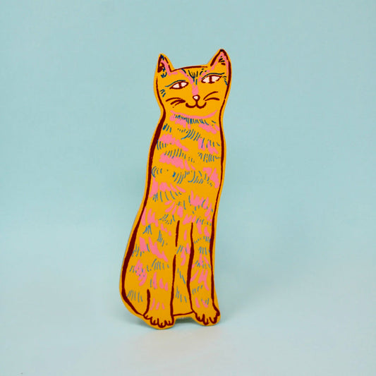 Colorful cat-shaped bookmark on a light blue background