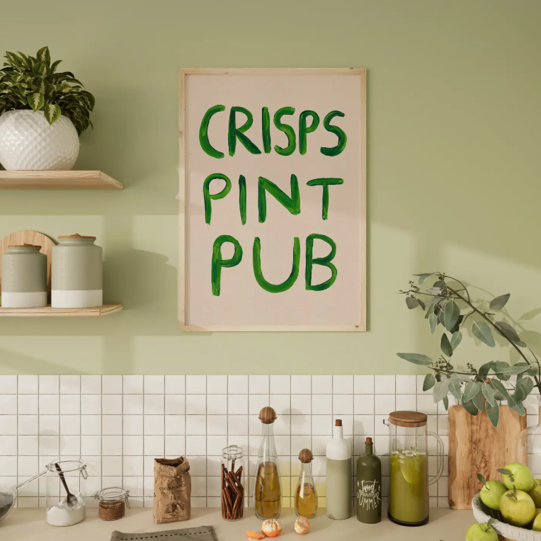 Kitchen with a sign reading 'CRISPS PINT PUB' on a green wall.
