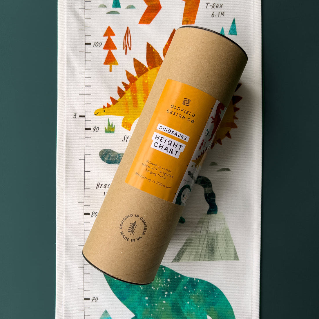 Rustic wooden height chart with dinosaur illustrations on a dark green background