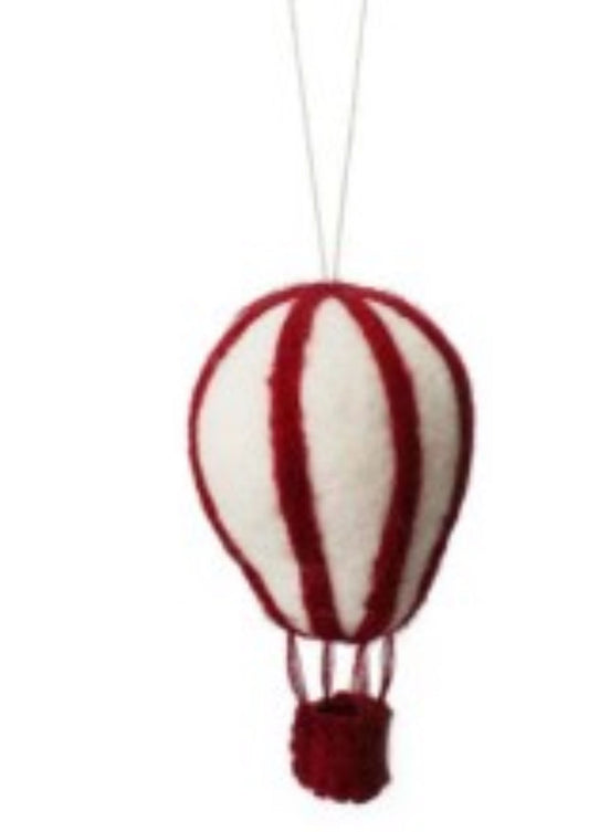 Red and white striped hot air balloon ornament on a white background