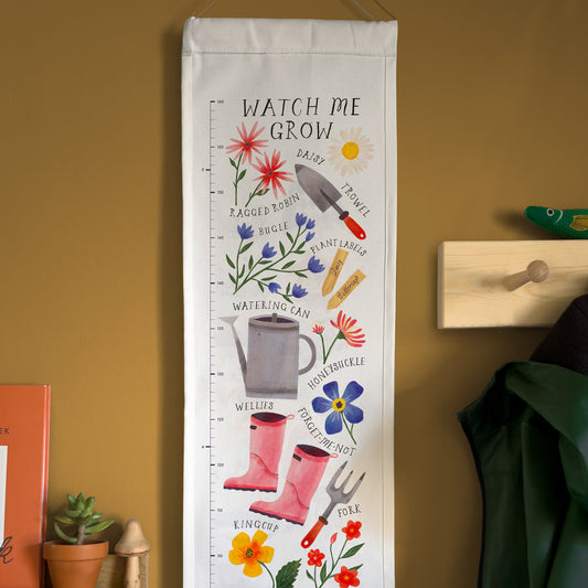 Growth chart with gardening-themed illustrations