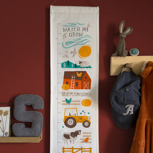 Growth chart with farm-themed illustrations ona white background