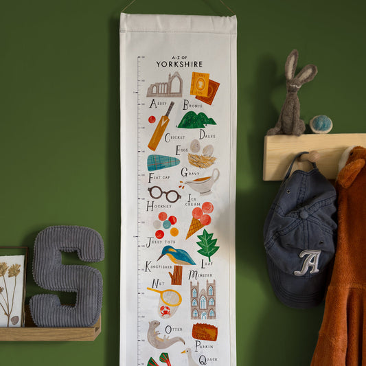 Growth chart with Yorkshire-themed illustrations on