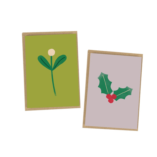Two greeting cards with floral and holly designs on a white background