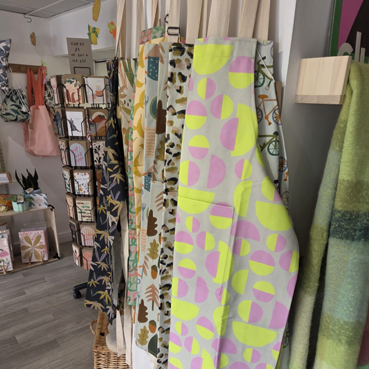 Display of colorful fabric panels in a store setting