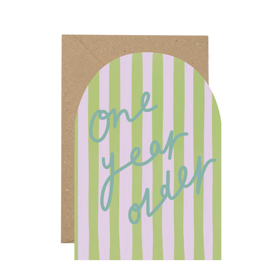 Card with 'One year older' text on a striped background