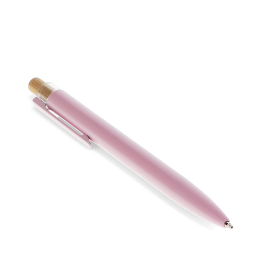 Pink pen with gold accents on a white background