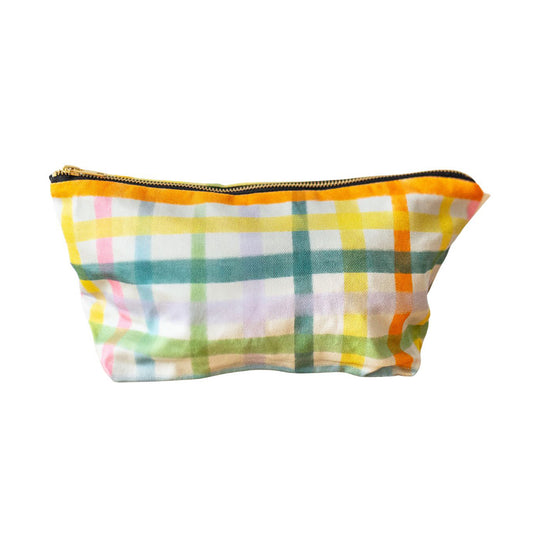 A multicolored gingham cosmetic bag Printed on sustainable cotton, with a high quality YKK brass zip and natural panama cotton lining.