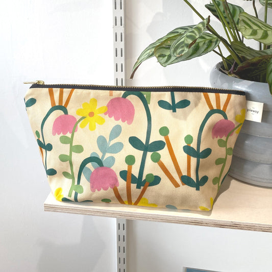 A floral cosmetic bag Printed on sustainable cotton, with a high quality YKK brass zip and natural panama cotton lining.