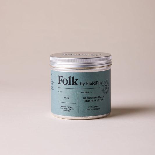 Tin candle jar labelled 'Folk by Field Day' scent - rain