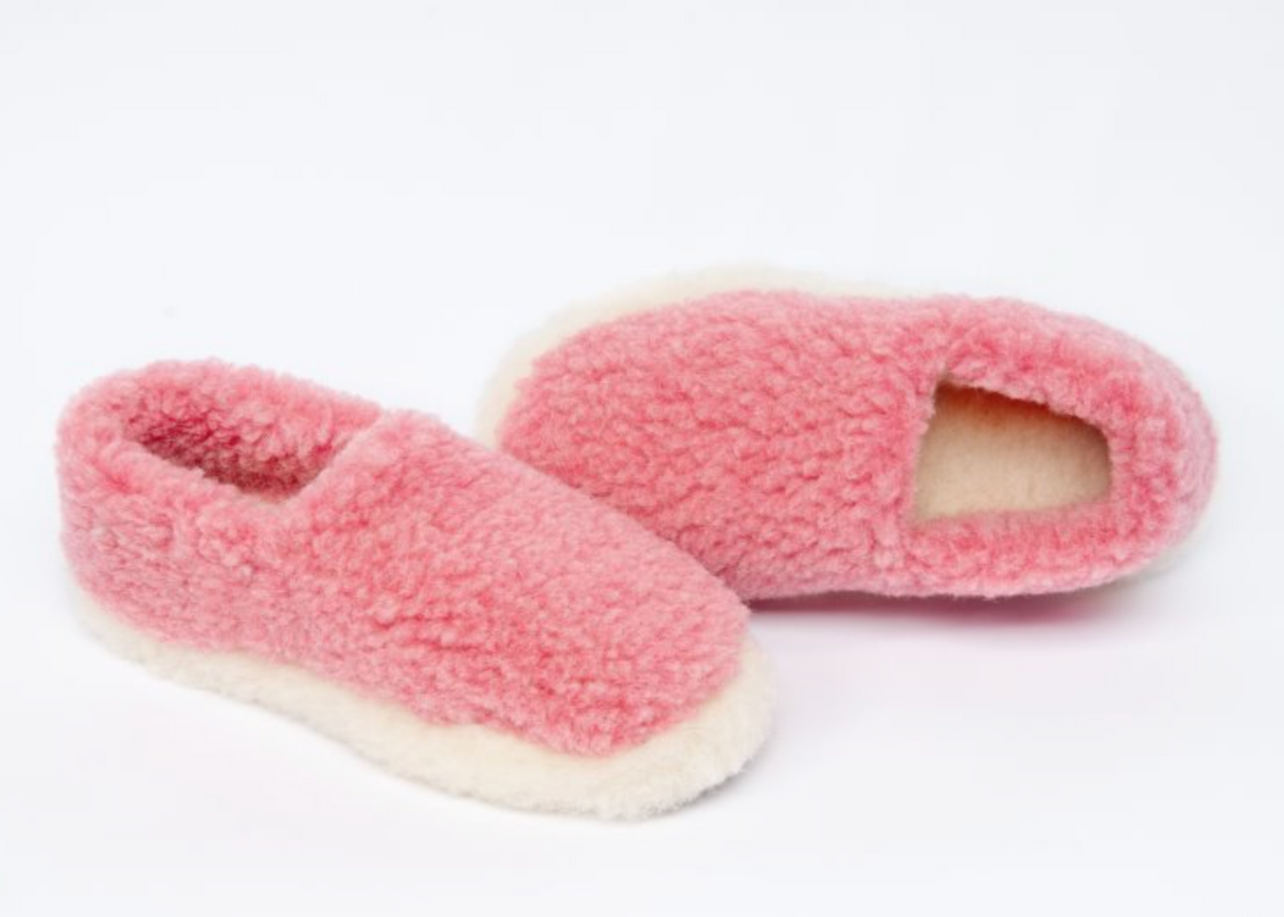 A pair of pink YOKO wool slippers with a two-tone colorway and an anti-slip sole.