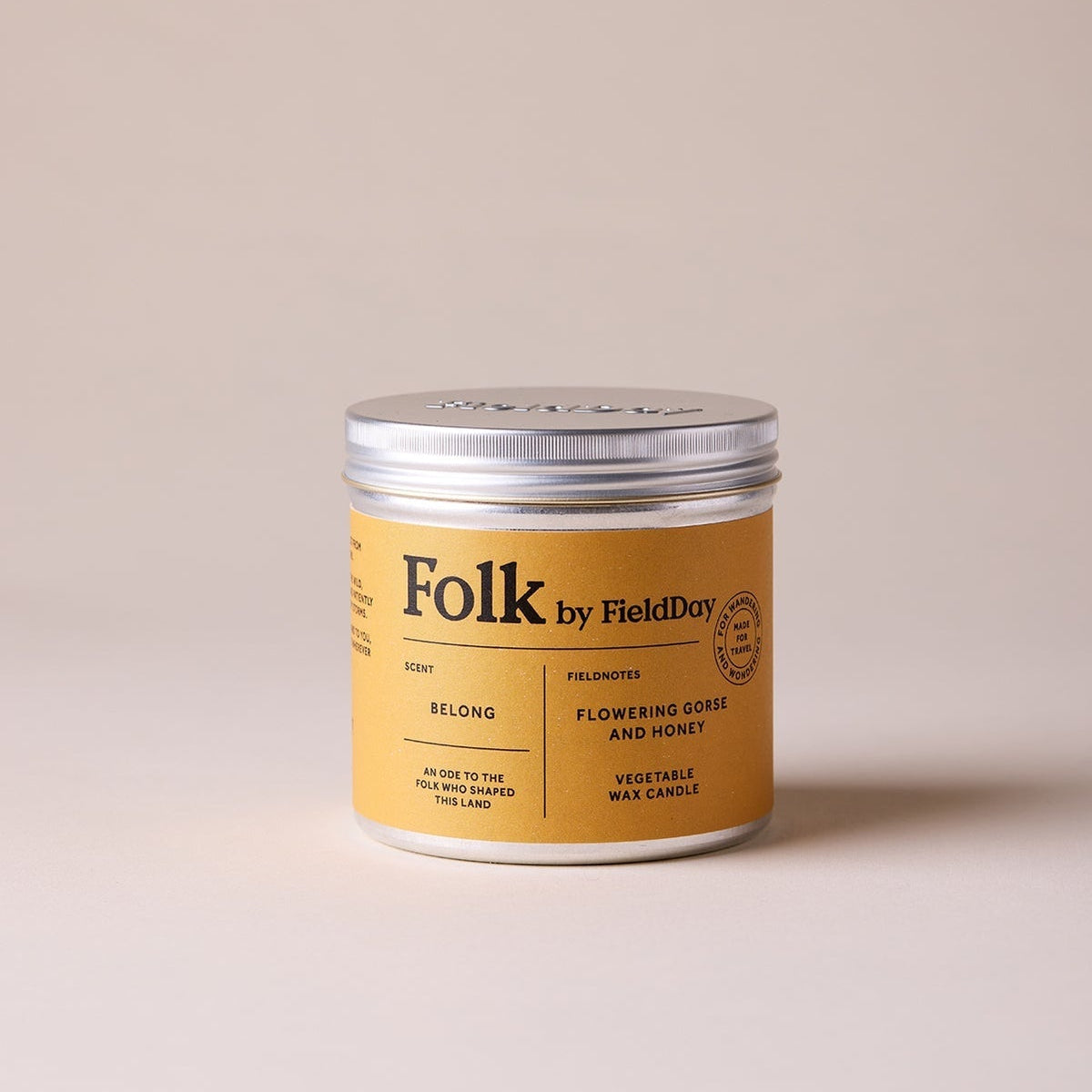 Folk by Field Day candle in a tin on a beige background
