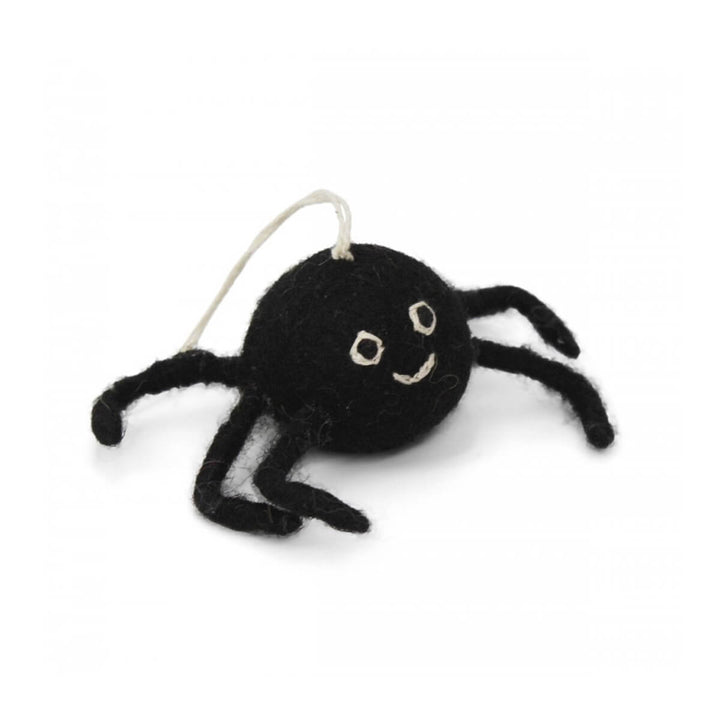 Black spider-shaped decoration with a white background