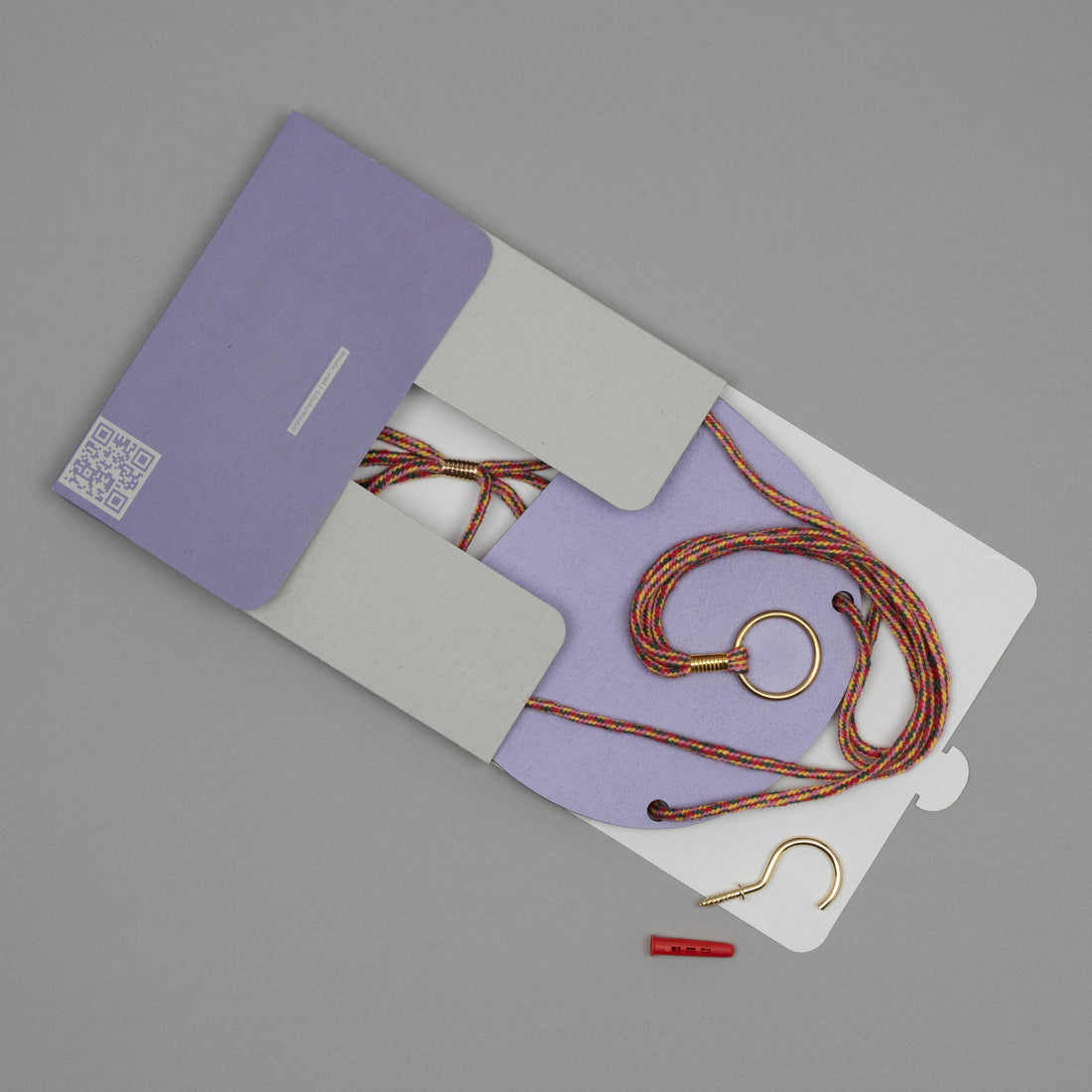 Hanging plant shelf set with purple case on a gray background