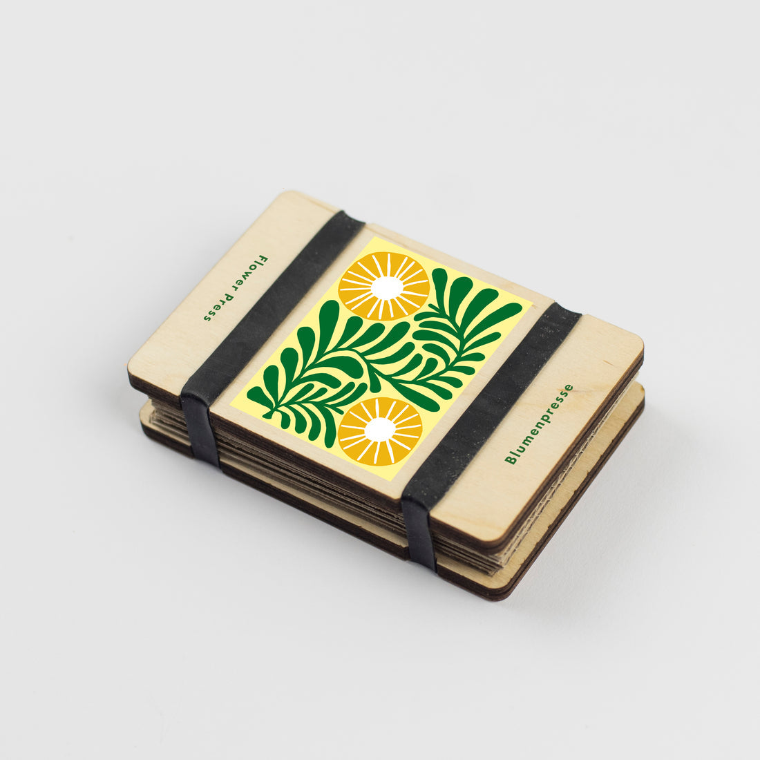 Rectangular flower press with flower design and 2 thick elastic bands to hold together