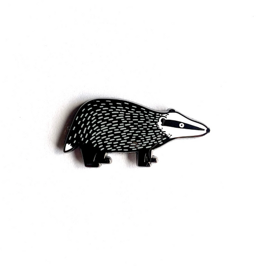 Black badger enamel pin badge on a white background