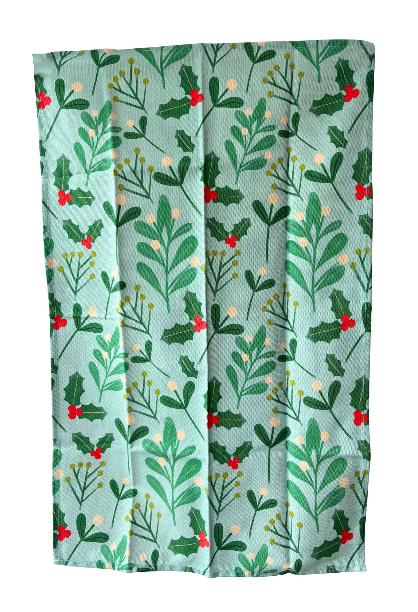 Festive fabric with holly leaf and berry pattern on a light blue background