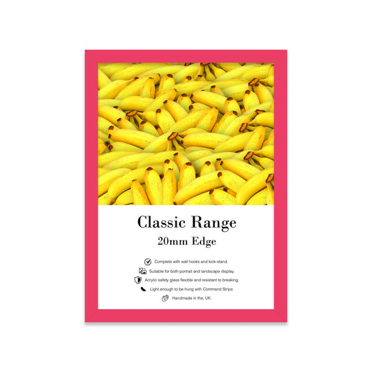 Framed picture of bananas with a pink border and white label.