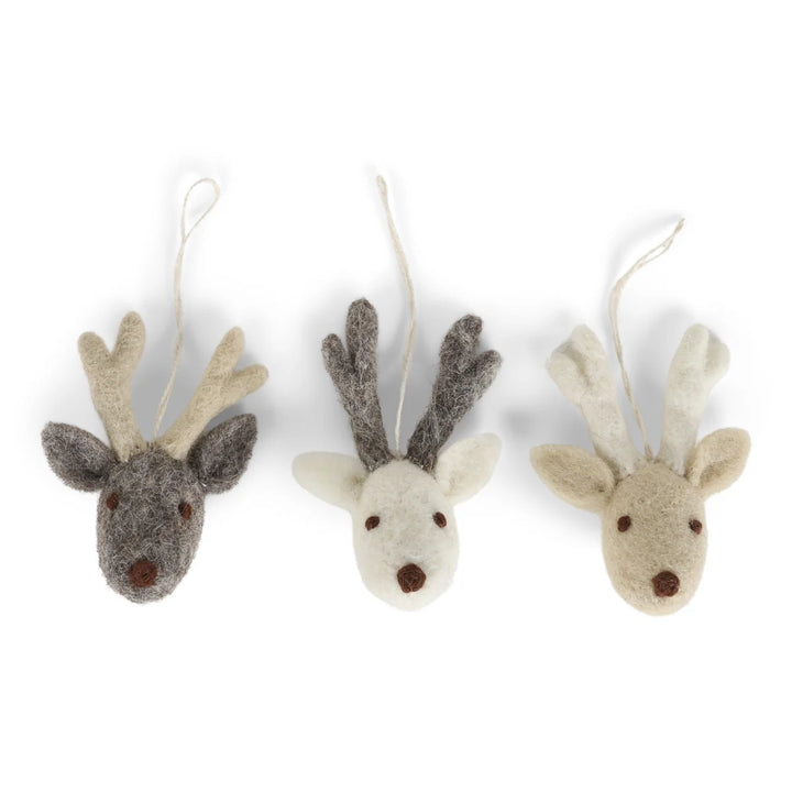 Three felt reindeer ornaments on a white background