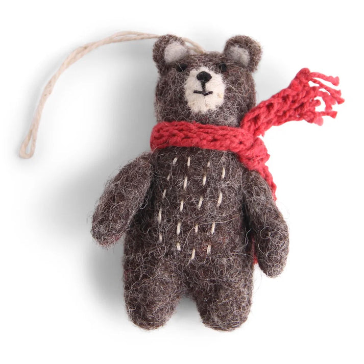 Small felt grey  bear ornament with a red scarf on a white background