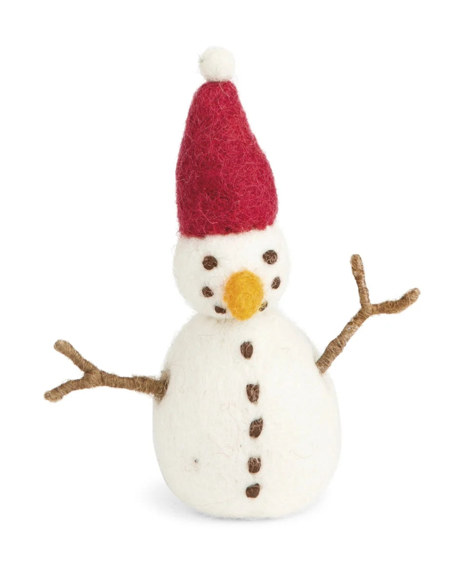 Small snowman figurine with a red hat on a white background handmade with felt