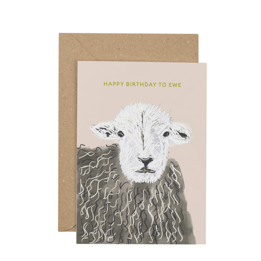 Greeting card with a sheep illustration and 'Happy Birthday to Ewe' text on a beige background.
