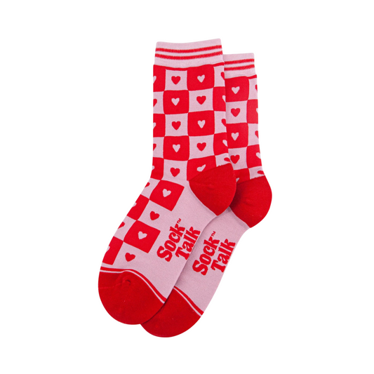 Red and white socks with heart pattern and 'Sock Talk' text on a white background