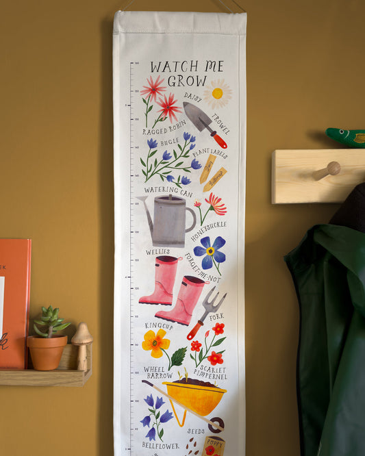 Growth chart with gardening-themed illustrations 