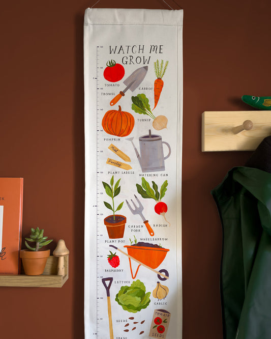 Growth chart with gardening-themed illustrations on