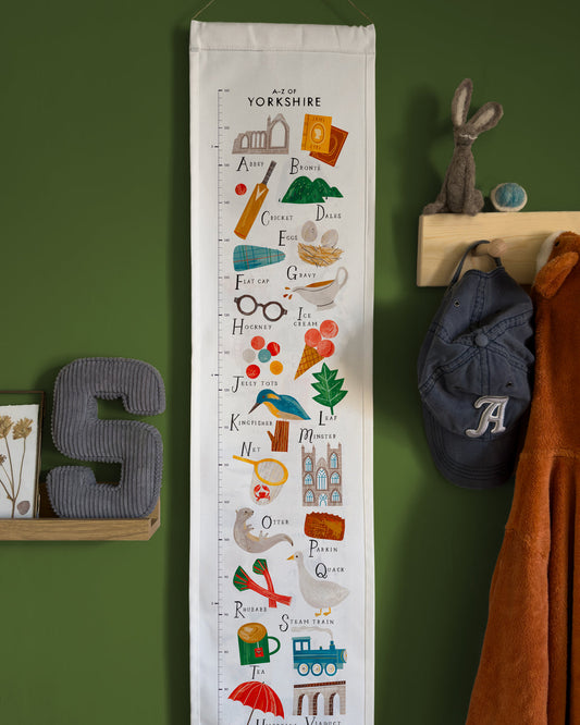 Growth chart with Yorkshire-themed illustrations on