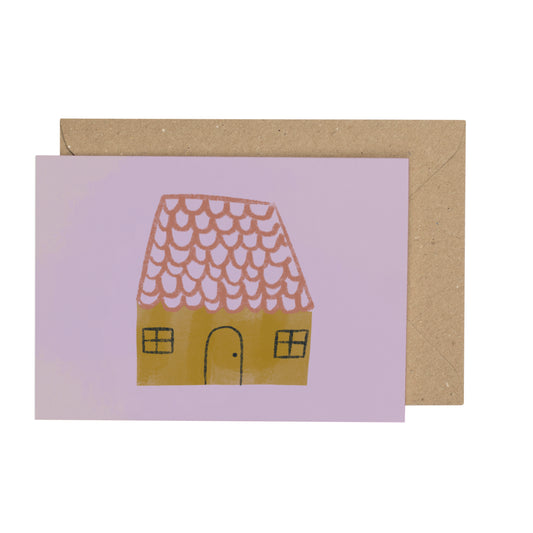 Card with a house illustration on a purple background, featuring a brown envelope.