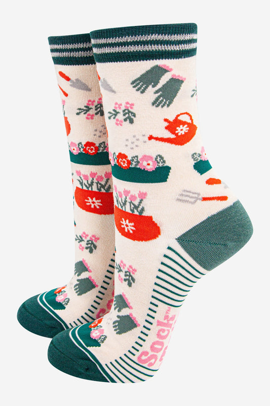 Pair of ladies socks with gardening-themed design 