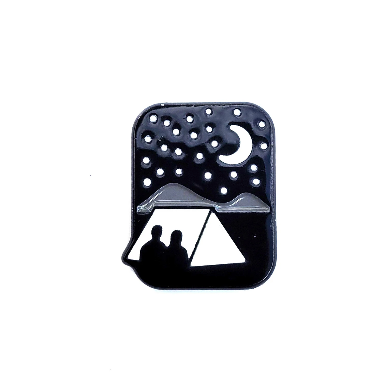 Black silhouette of a campsite with two people under a tent against a starry night sky on a white background.