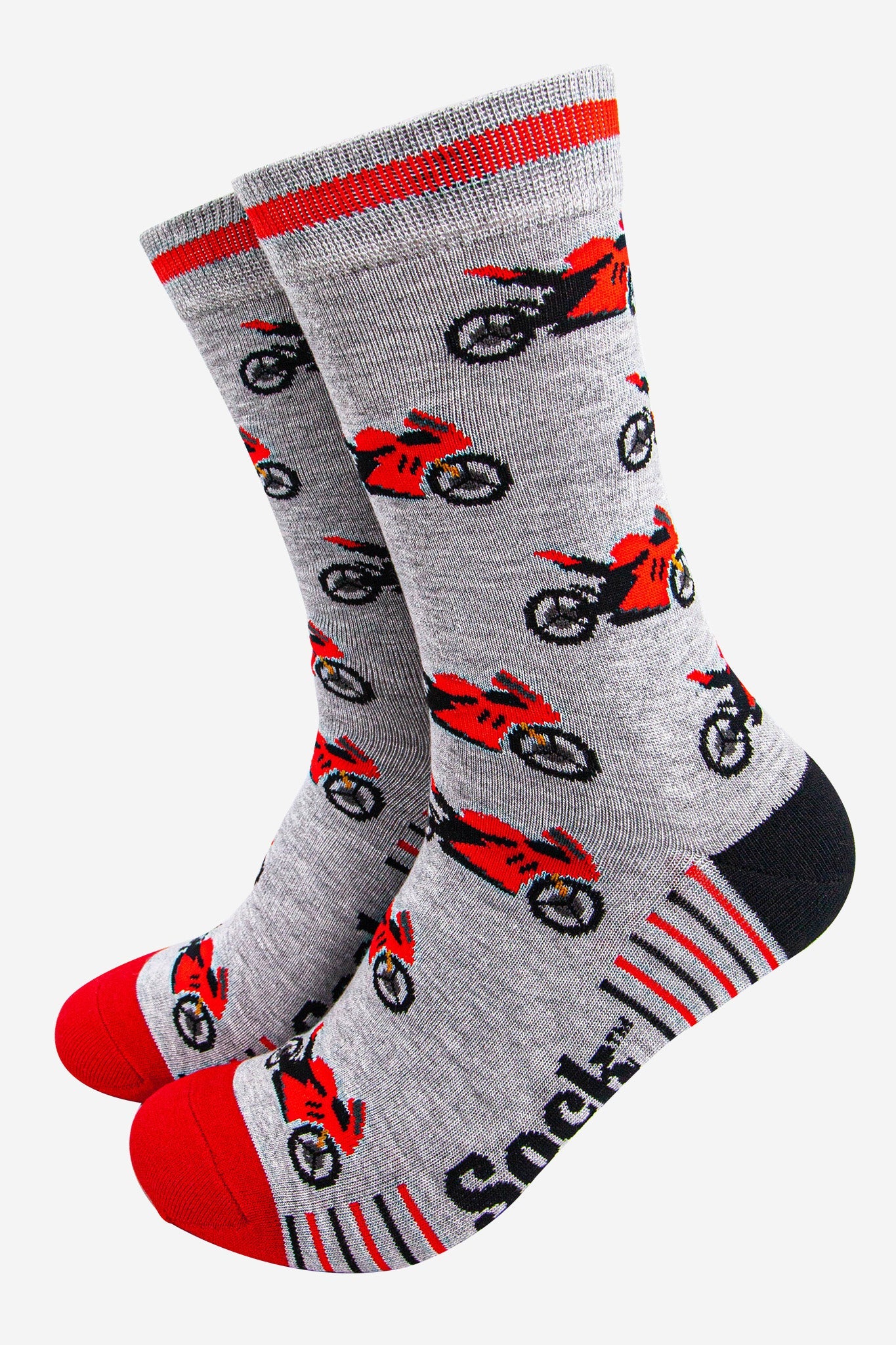 Grey socks with red and black motorcycle pattern on a white background