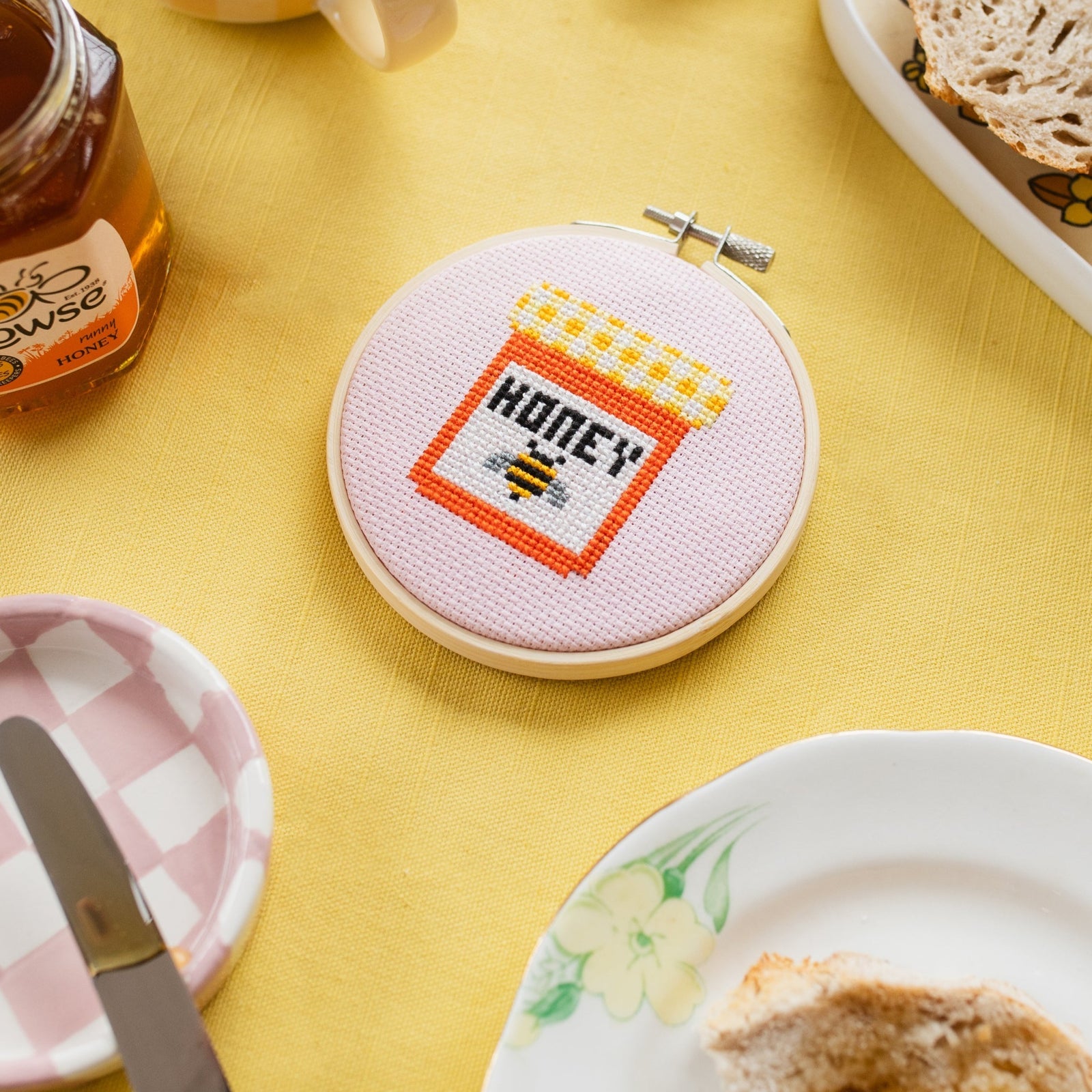 cross stitch kit in wooden embroidery hoop, pot with text HONEY and bee design   