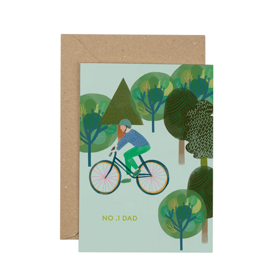 Greeting card with a cyclist in a forest design and brown envelope.