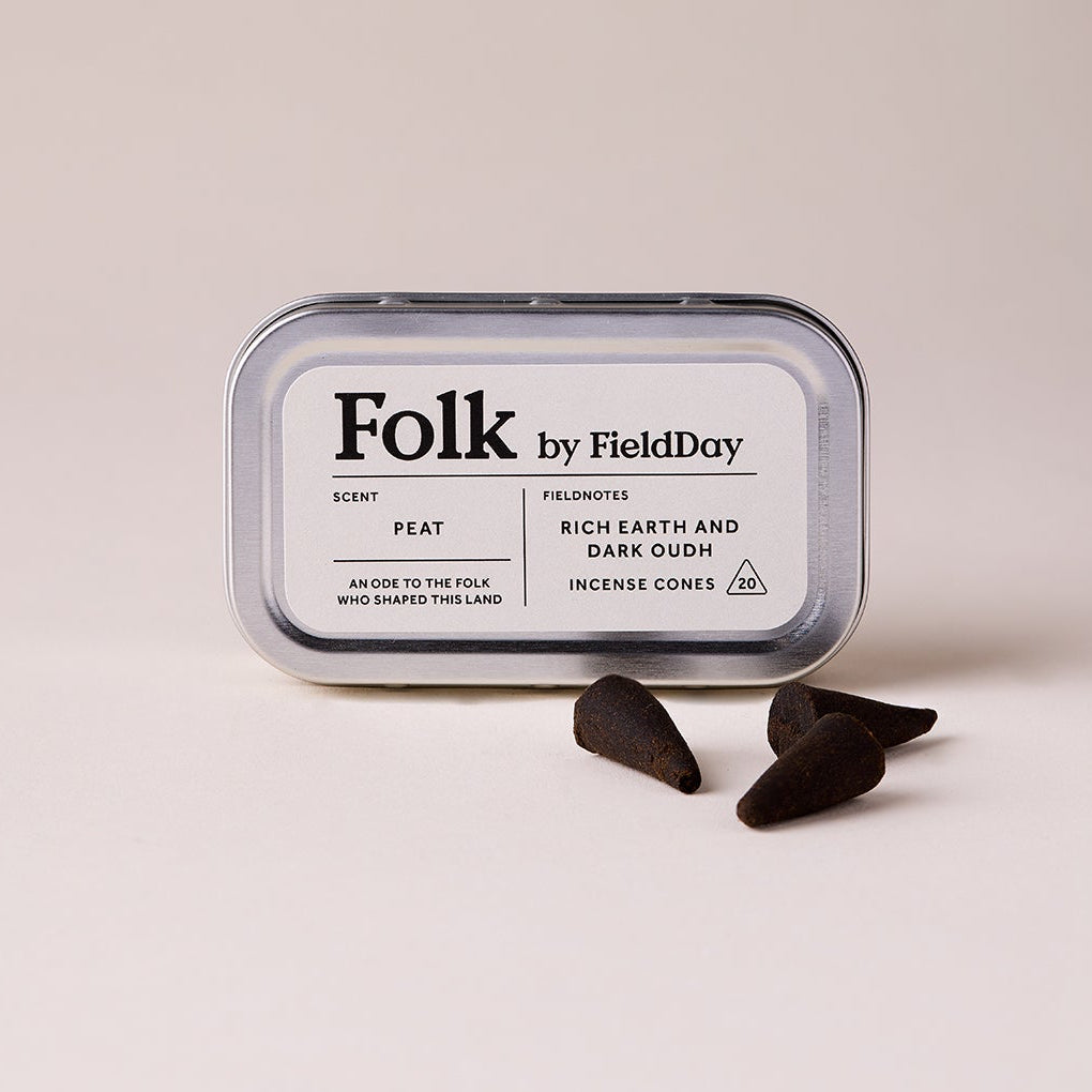 Folk by Field Day incense cones in a tin  on a beige background