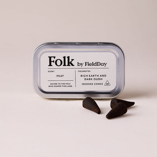 Folk by Field Day incense cones in a tin  on a beige background