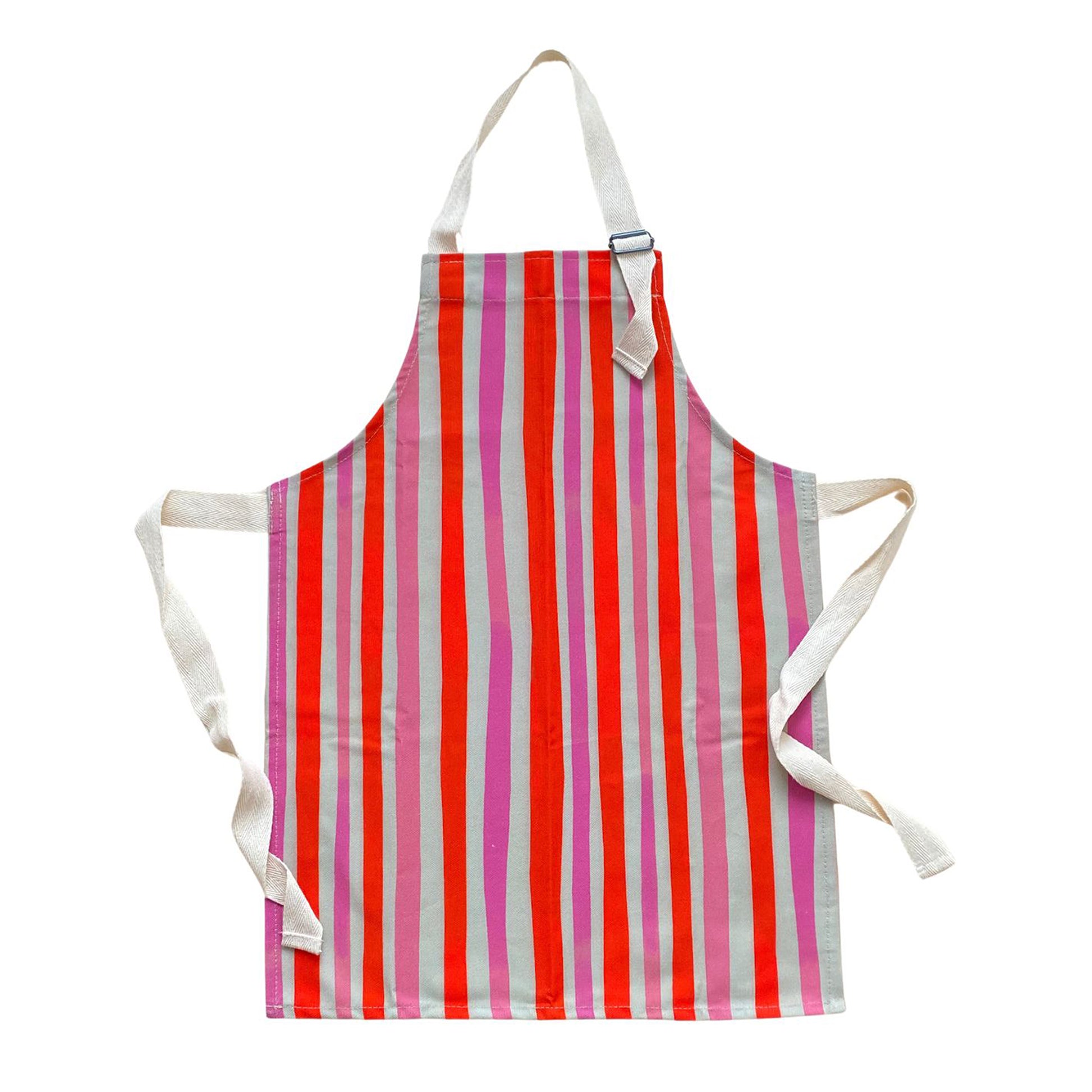 A child's apron with red and pink vertical stripes and white straps.