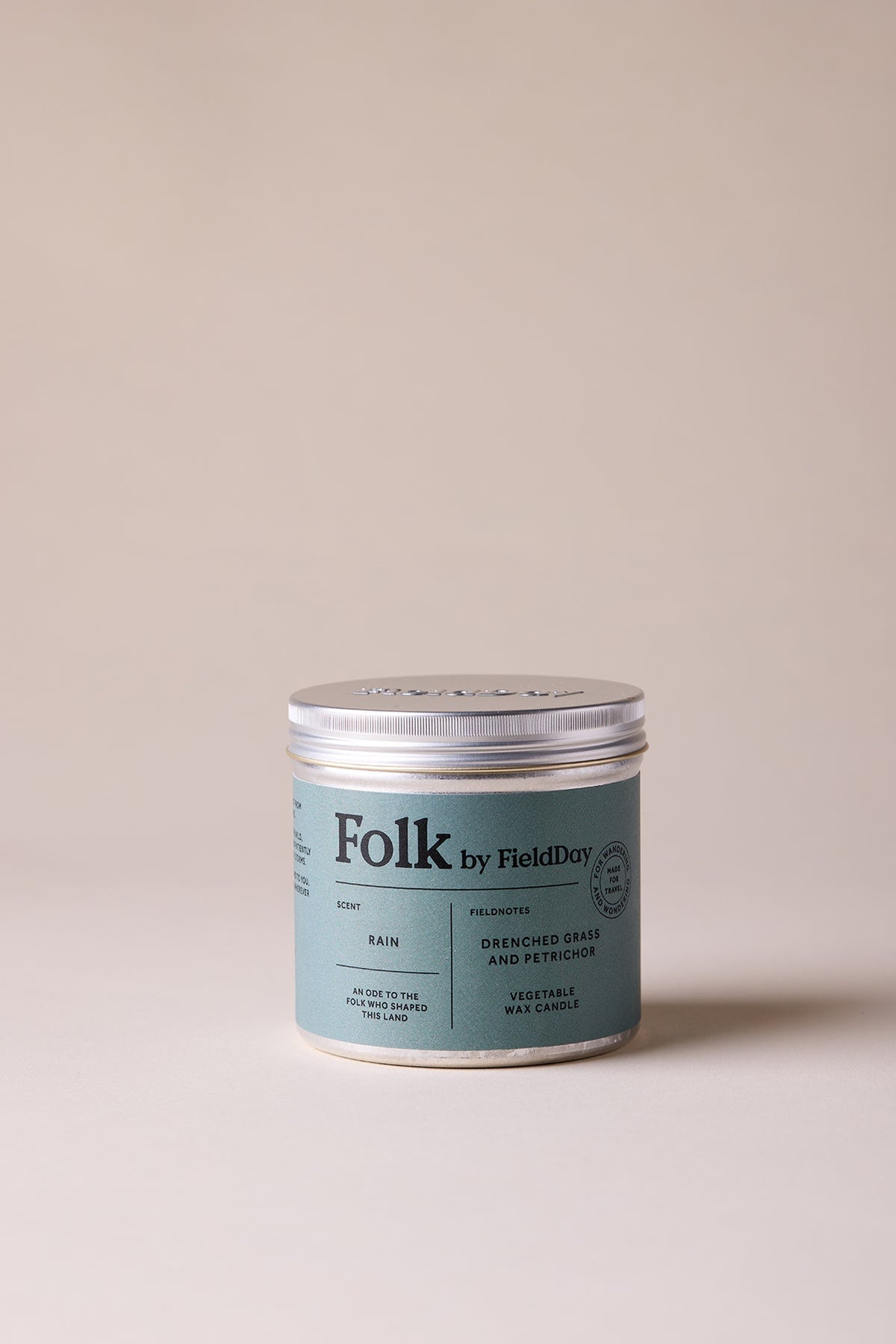 Tin candle jar labelled 'Folk by Field Day'  scent - rain